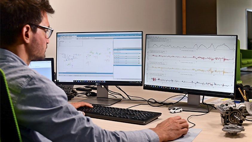 An engineer is using the Simcenter software for model-based engineering.
