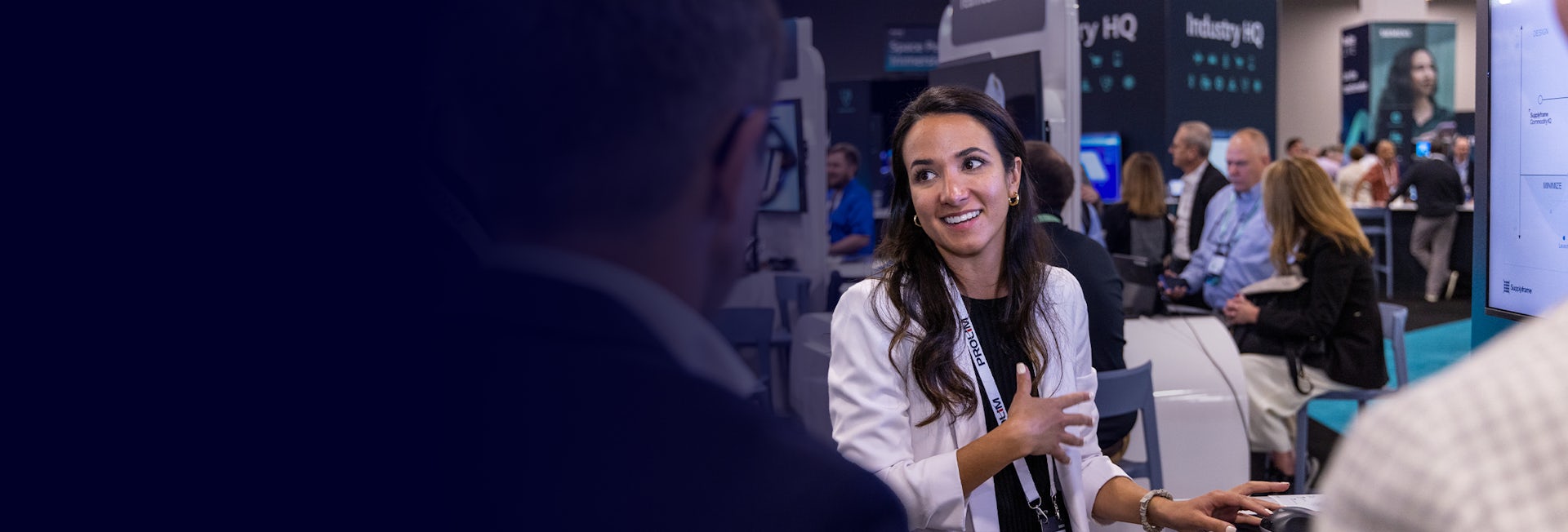 A sponsor interacts with customers at the Realize LIVE expo.